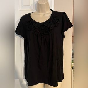 Elle short sleeved top with flower embellishment at opening. Black, Size L. EUC